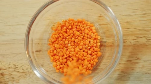 Red Lentils Filling a Glass Bowl