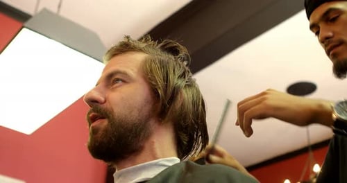 Man Getting Haircut at Barber Shop