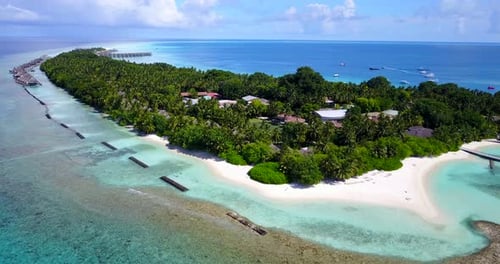 Tropical overhead island view of a sunshine white sandy paradise beach and turquoise sea background