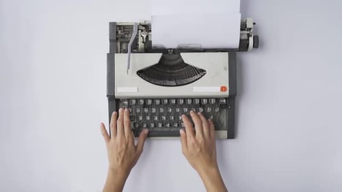 People hands typing an old Thai traditional typewriter. Classic vintage antique