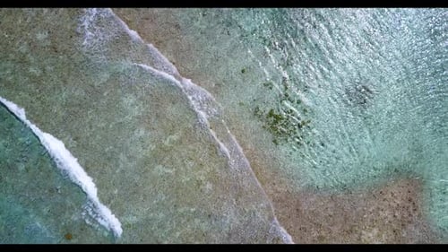 Aerial view seascape of paradise island beach trip by aqua blue water with bright sandy background o