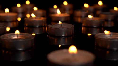 Funeral candle close up on black background