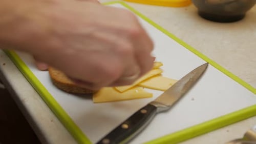 Person Making Simple Sandwich on Cutting Board
