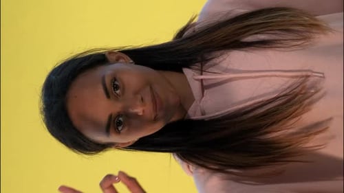 Woman Gives OK Sign and Two Thumbs Up