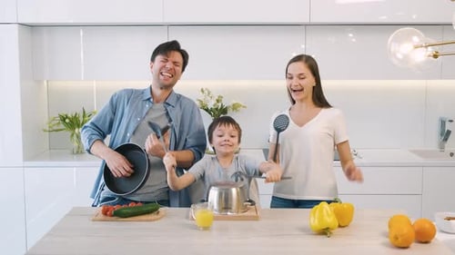 Playful Family Making Music in Modern Kitchen