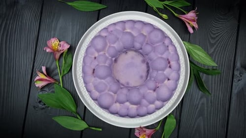 Overhead of Pastel Purple Dessert with Pink Flowers