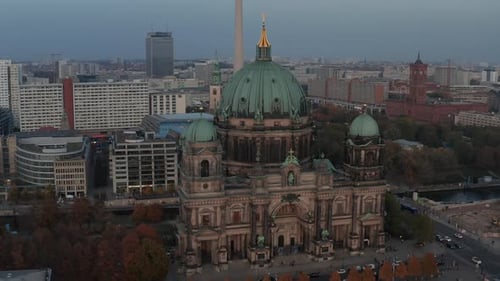 AERIAL: Circling Berlin Cathedral Beautiful Old Structure in Vibrant Fall Colors with Golden Cross