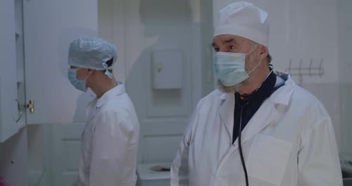 Healthcare Workers Hold Coronavirus Protection Sign