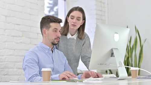 Teamwork in Bright Office with Computer