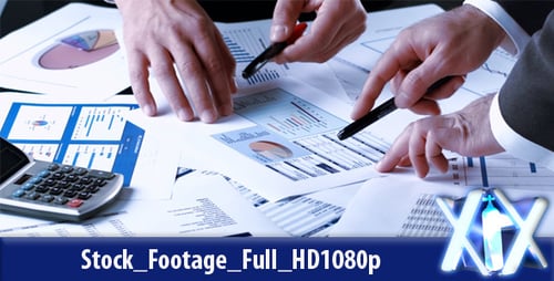 Professionals Analyzing Business Data with Charts and Calculator