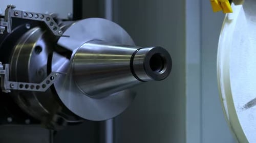 Metal Piece Rotating at High Speed in Machine