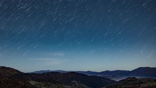 Long Exposure Starry Sky with Clouds Floating at Late Night