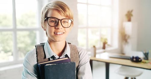 Smiling Schoolboy with Books and Backpack Indoors
