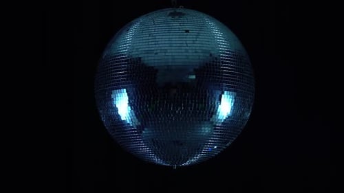 Spinning Mirrored Disco Ball Reflecting Geometric Light