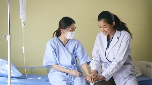 Doctor Checking Patient's Pulse at the Hospital