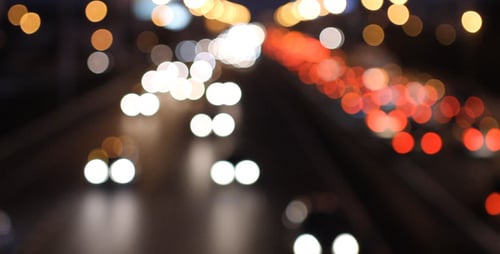 Nighttime City Highway with Bokeh Lights