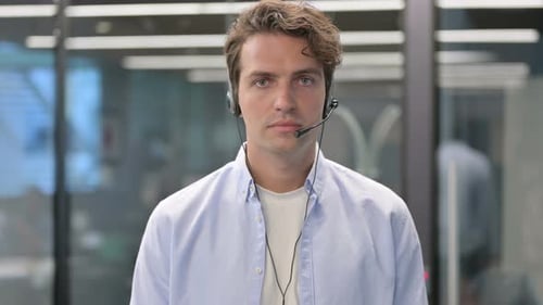 Young Adult Wearing Headset in Office