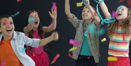 Children Celebrate with Confetti and Party Hats