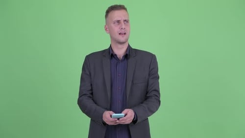 Man in Suit Using Phone, Smiling, Green Screen