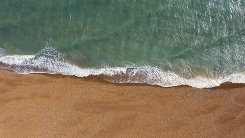 Tropical beach aerial background, Sea waves seamless on coastline. 4K