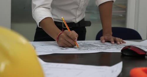Architect Working On Blueprint