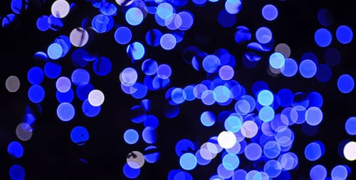 Abstract Blue and White Bokeh Lights Shimmering