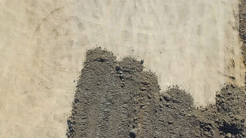 Aerial View of Bulldozer Leveling Rocky Terrain
