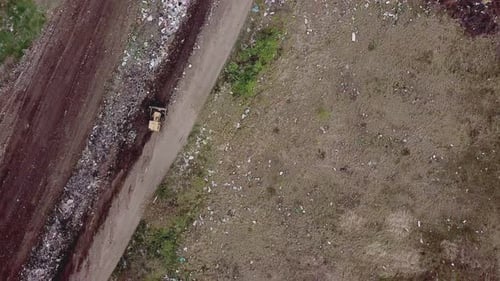 Bulldozer Works at Open Rural Landfill, Aerial View