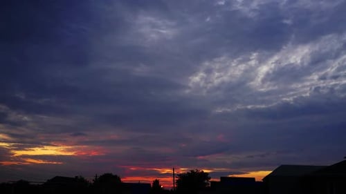 Timelapse with Sunset Sky Over Houses Village