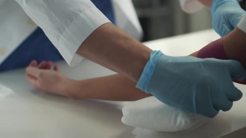 Preparing Arm for Medical Blood Draw in Hospital