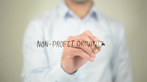Non-Profit Organization, Businessman Writing on Transparent Screen