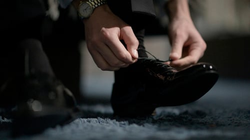 Man Tying Shoes