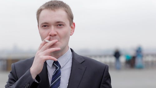 Businessman Thinking While Smoking A Cigarette