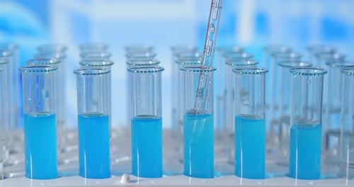 Lab Assistant Adding Green Liquid in Test Tube, Monitoring Chemical Reaction. Technician Carefully