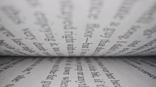 Macro View Inside Book Slide Dolly Shot with Laowa Probe Lens. Camera Moves Between Paper Book Pages