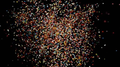 Abstract Burst of Colorful Confetti-Like Particles on Black