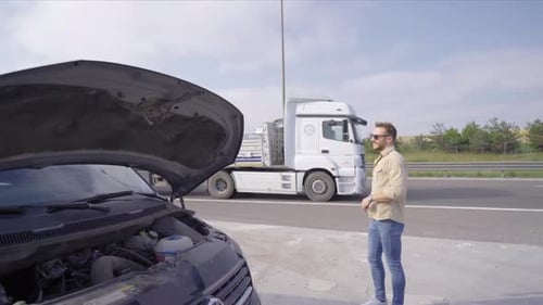 Frustrated man whose car broke down.