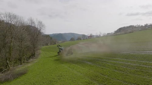 Tractor driver spraying and fertilizing the field. Agricultural machinery, working day. Farmland, No