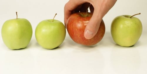 Fresh Green Apples and One Red Apple