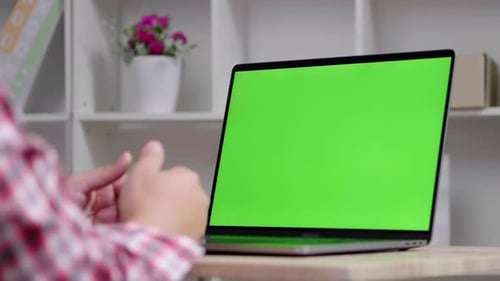 Close up laptop with green screen on the laptop