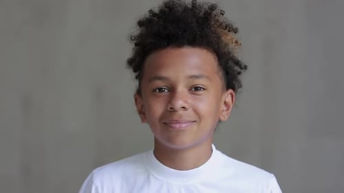 Smiling Boy with Curly Hair Portrait