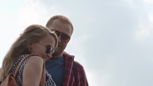 Young Couple Hiking Together on Sunny Day
