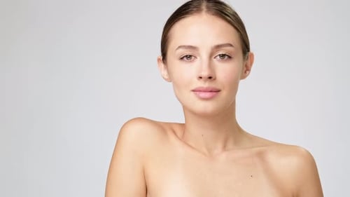 Elegant Woman with Natural Beauty Posing in Studio