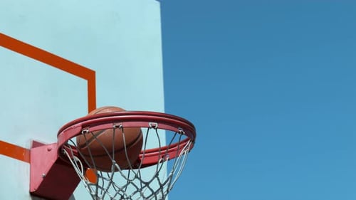 Super slow motion shot of basketball going into hoop, shot on Phantom Flex 4K