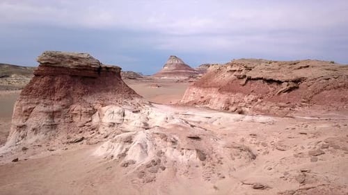 Flying low through red rocky desert viewing the landscape