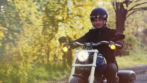 Man Driving Motorbike in Countryside