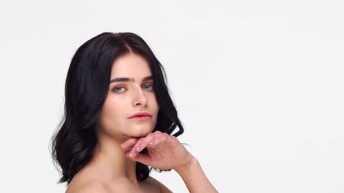 Studio portrait of young and beautiful brunette woman.
