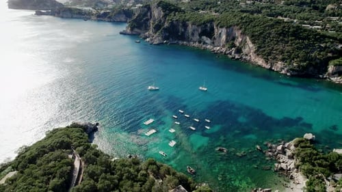 Aerial Drone View to Clear Blue Sea Water with Moored Boats and Yachts