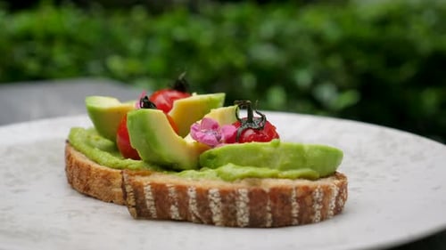 Close Up of Avocado Toast with Cherry Tomatoes