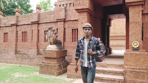 Young African American man walking travel In Thailand with Ancient Temples.